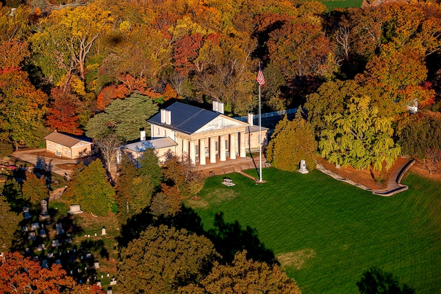 Aerial view of Arlington House surrounded by fall foliage.