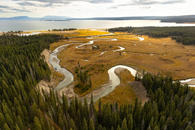 A creek winds towards a large lake