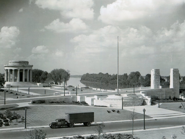 The Clark memorial and bridge approach with agriculture truck in foreground.