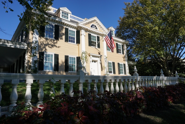 mansion highlighted by the changing colors of fall