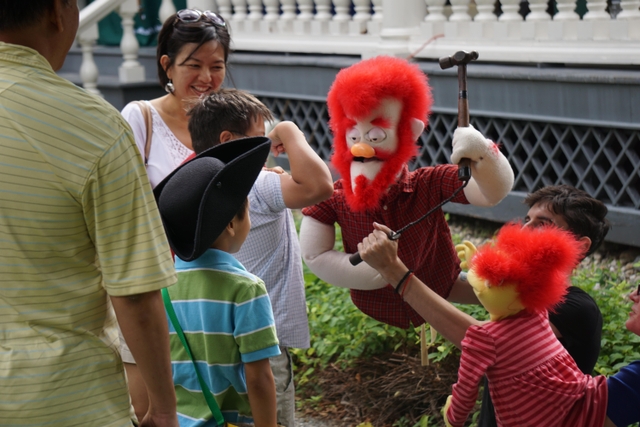 children interacting with puppet