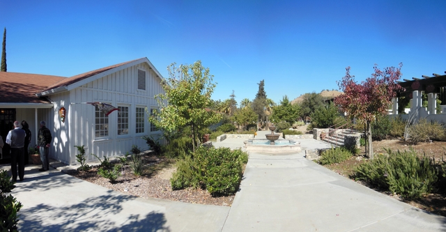 A walkway with a fountain