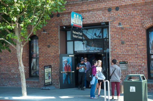 An open double door into a brick building.