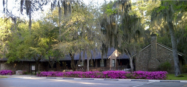 Brick building of the Visitor Center with Azaleas blossoming in front