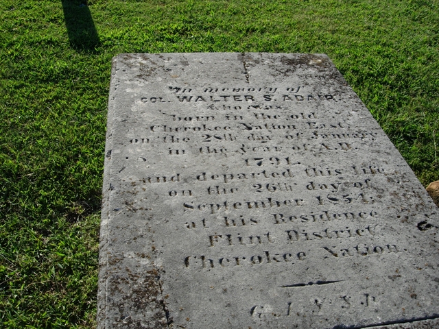 gravestone with words etched, green grass