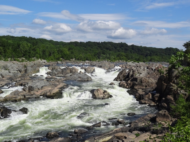 The rushing river cascades over the rocks of the Potomac