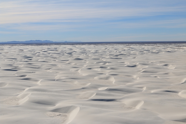 Aerial of white sand dunes.