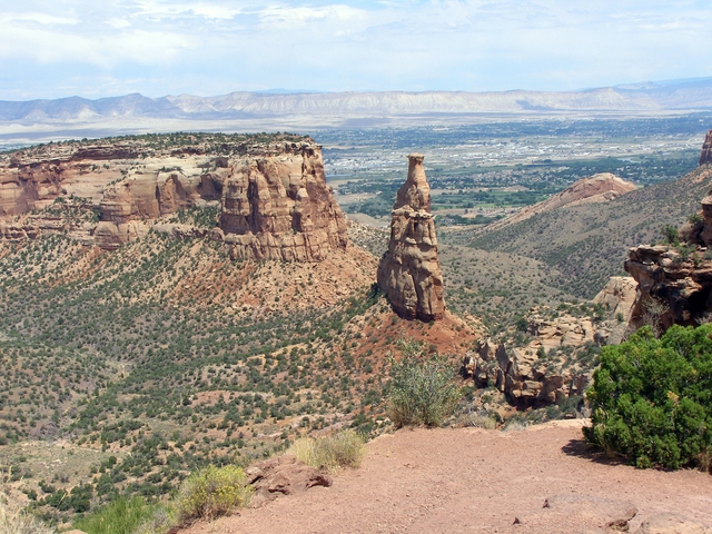 View of Independence Monument with Grand Valley in background. Taken from Rim Rock Rock Drive.