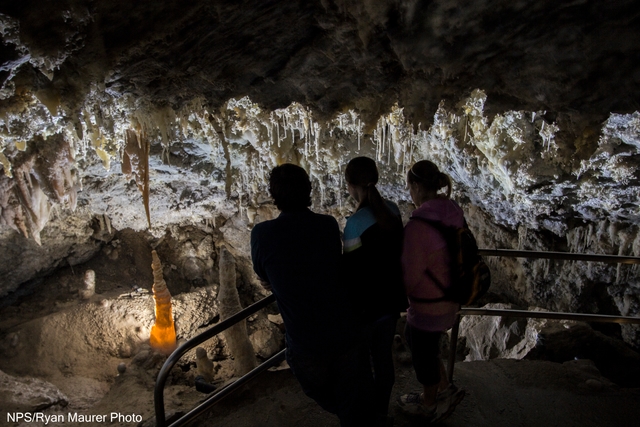 Visitors gaze at delicate cave formations in Timpanogos Cave's Chimes Chamber