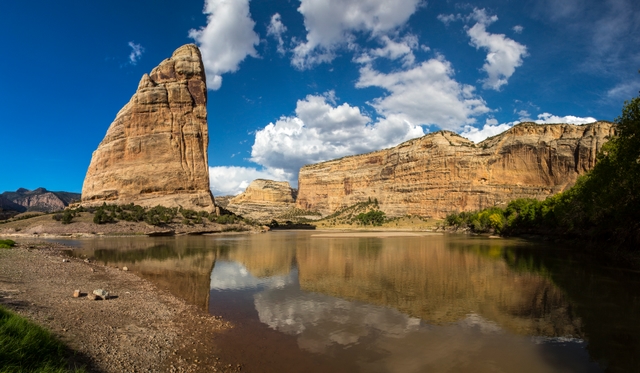 the rocky pinnacle of Steamboat Rock rises over the Green River