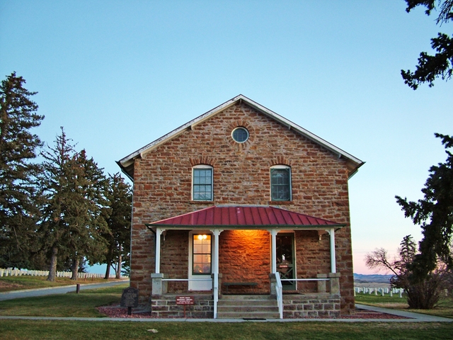 The stone house sits on the edge of the Custer National Cemetery.