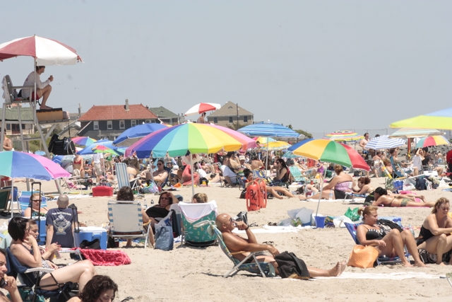 Visitors enjoying the sun and sand at Jacob Riis Park