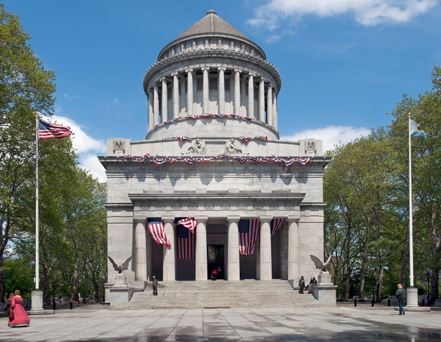 Mausoleum and flags in sunny weather