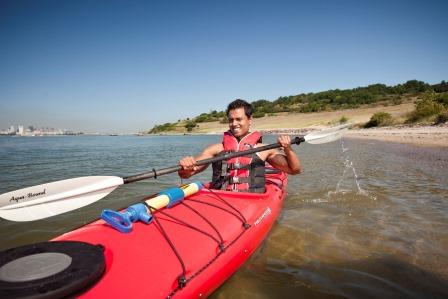 A man on a kayak in Boston Harbor