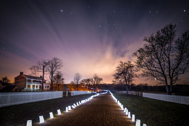 The McLean House during the 150th Anniversary with luminaries along the Stage Road.