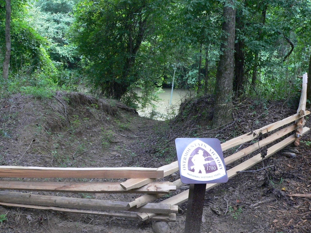 The OVVI NHT marker is on a fence with the Green River in the background.