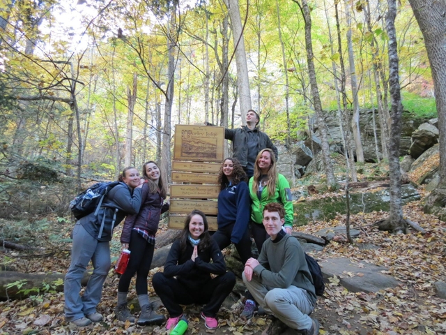 Youth gather around a trail head