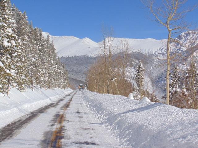 A road is covered with a layer of snow and ice