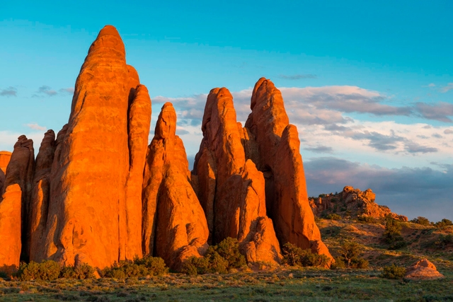 Red sandstone fins glow in sunset lighting