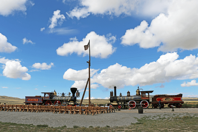 Two locomotives the 119 and Jupiter facing each other on a track.