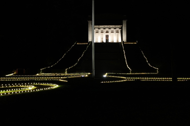 The Memorial Building at night lit up by white light