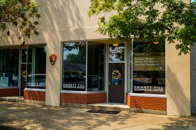 Exterior of a store front with the NPS arrowhead on the building